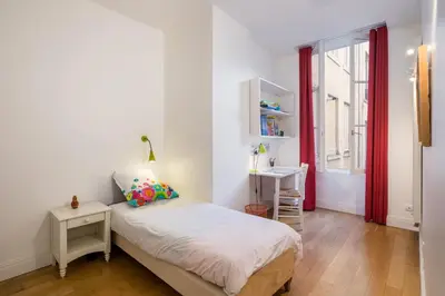 Un ou plusieurs lits dans un hébergement de l'établissement Le Trompettiste - Newly refurbished flat