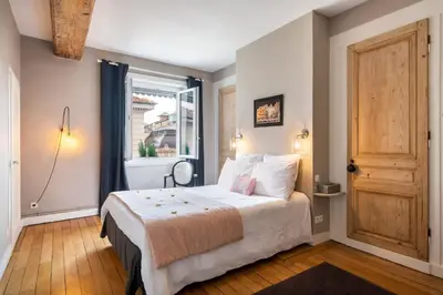 Un ou plusieurs lits dans un hébergement de l'établissement Les Célestins - Appartement avec vue splendide