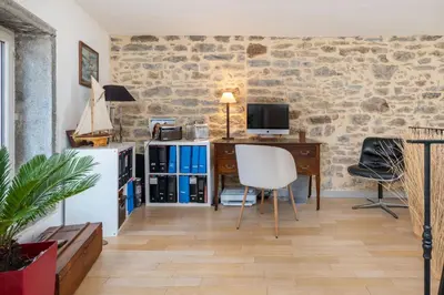 Coin salon dans l'établissement Le Cerf - House with view and swimming pool