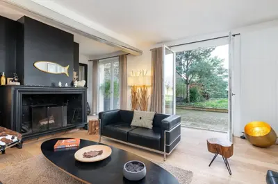 Coin salon dans l'établissement Le Cerf - House with view and swimming pool