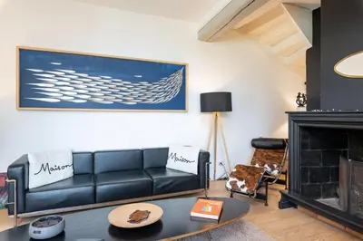 Coin salon dans l'établissement Le Cerf - House with view and swimming pool