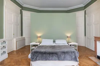 Un ou plusieurs lits dans un hébergement de l'établissement L'Authentique - Appartement en coeur de ville