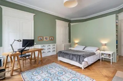 Un ou plusieurs lits dans un hébergement de l'établissement L'Authentique - Appartement en coeur de ville