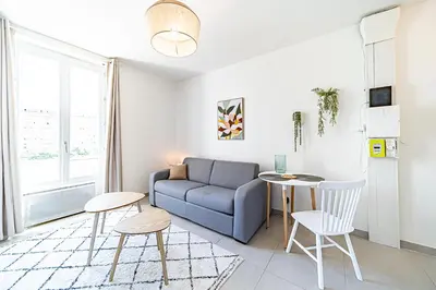 Coin salon dans l'établissement Le Petit Clément - Charmant et Cosy