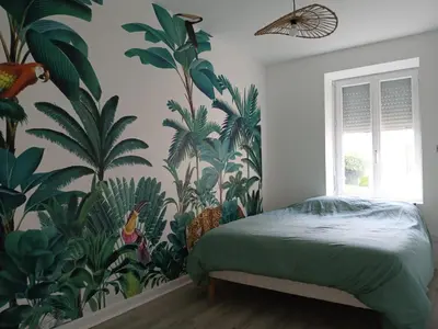 Un ou plusieurs lits dans un hébergement de l'établissement Tropical marlieux