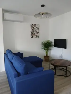 Télévision ou salle de divertissement dans l'établissement Tropical marlieux
