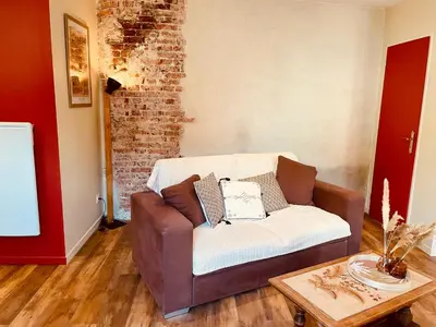 Coin salon dans l'établissement Le Cocon Forézien - Emplacement idéal & Charme irrésistible
