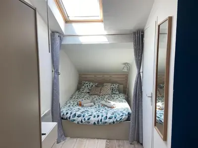 Un ou plusieurs lits dans un hébergement de l'établissement Studio Cosy Proche Centre Ville