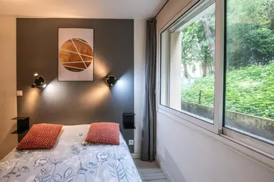 Un ou plusieurs lits dans un hébergement de l'établissement Central Part-Dieu - Appartement 2