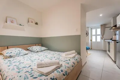Un ou plusieurs lits dans un hébergement de l'établissement Studio Les Etoiles de Chasselay