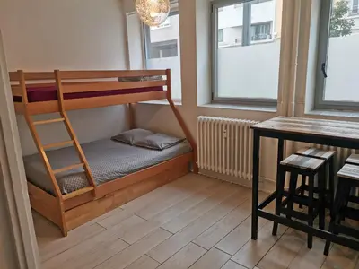 Un ou plusieurs lits dans un hébergement de l'établissement Studio Cours Emile Zola Métro République