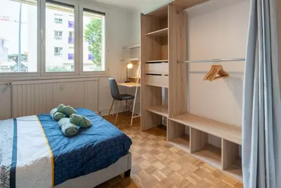 Un ou plusieurs lits dans un hébergement de l'établissement Appartement rénové pour 6 avec parking