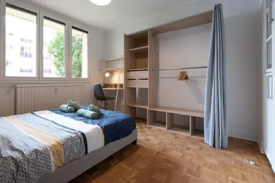 Un ou plusieurs lits dans un hébergement de l'établissement Appartement rénové pour 6 avec parking