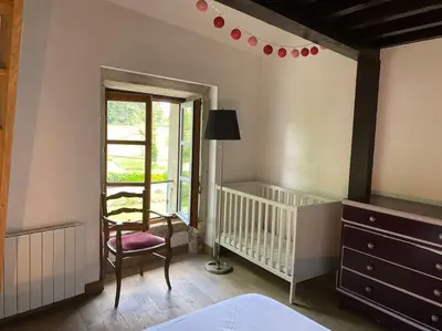 Un ou plusieurs lits dans un hébergement de l'établissement Château Frontonas gîte ferme