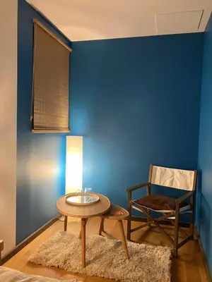 Coin salon dans l'établissement Une chambre d'hôte dans les bois