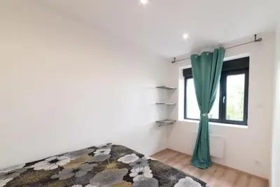 Un ou plusieurs lits dans un hébergement de l'établissement Appartement Fashion Proche Stade Groupama , Eurexpo , LDLC Arena
