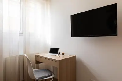 Télévision ou salle de divertissement dans l'établissement Douceur de Vivre Urbaine Jonage GROUPAMA STADIUM - ARENA - LYON AEROPORT SAINT EXUPERY - EUREXPO