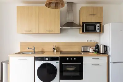 Cuisine ou kitchenette dans l'établissement Douceur de Vivre Urbaine Jonage GROUPAMA STADIUM - ARENA - LYON AEROPORT SAINT EXUPERY - EUREXPO