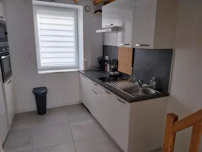 Cuisine ou kitchenette dans l'établissement Appartement cosy et calme