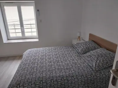Un ou plusieurs lits dans un hébergement de l'établissement Appartement cosy et calme