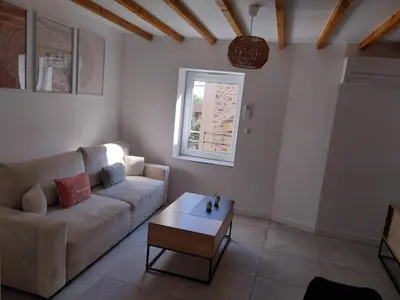 Coin salon dans l'établissement Appartement cosy et calme