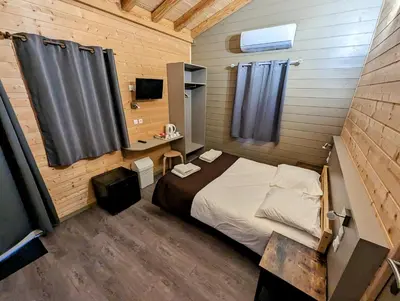 Un ou plusieurs lits dans un hébergement de l'établissement Lodge Hôtel & Spa Les Voiles du Grand Large