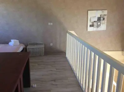 Un ou plusieurs lits dans un hébergement de l'établissement Beaujolais Charentay lyon Maison avec piscine