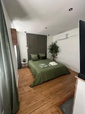 Un ou plusieurs lits dans un hébergement de l'établissement Studio cosy cœur de ville