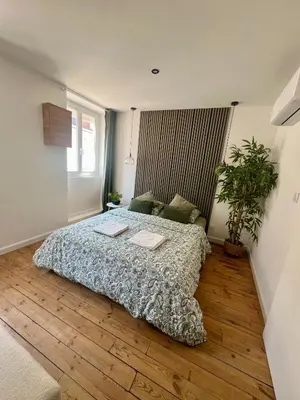 Un ou plusieurs lits dans un hébergement de l'établissement Studio cosy cœur de ville