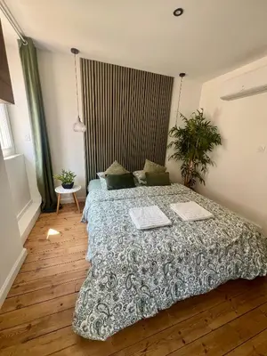 Un ou plusieurs lits dans un hébergement de l'établissement Studio cosy cœur de ville