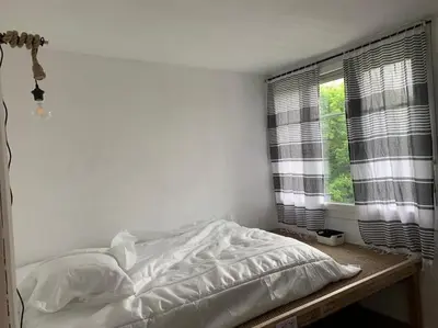 Un ou plusieurs lits dans un hébergement de l'établissement HOMEYPIC LYON T3 vue sur la Saône