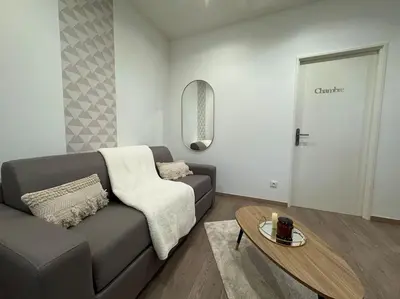 Coin salon dans l'établissement Joli Appartement Saint-germain
