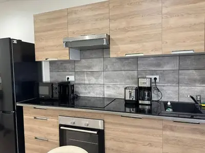 Cuisine ou kitchenette dans l'établissement Joli Appartement Saint-germain