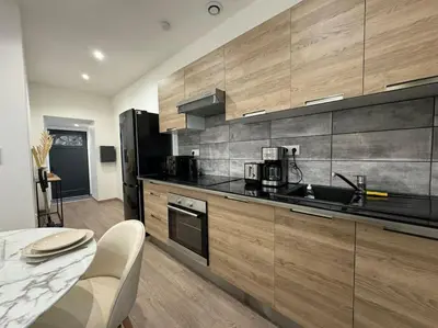 Cuisine ou kitchenette dans l'établissement Joli Appartement Saint-germain