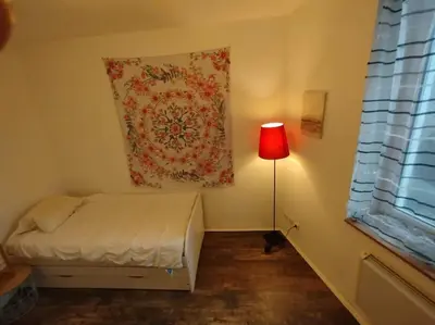Un ou plusieurs lits dans un hébergement de l'établissement HOMEYPIC T3 en rez de jardin proche de Lyon