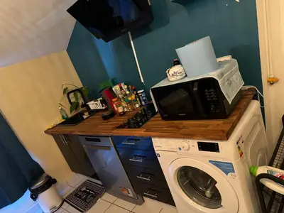 Cuisine ou kitchenette dans l'établissement Bonheur
