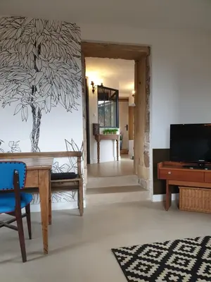 Télévision ou salle de divertissement dans l'établissement Charmante maison de famille près de Lyon
