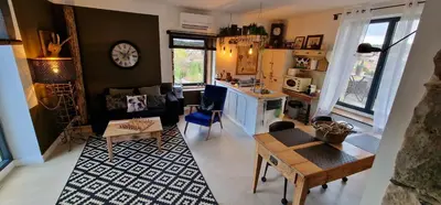 Coin salon dans l'établissement Charmante maison de famille près de Lyon