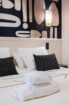 Un ou plusieurs lits dans un hébergement de l'établissement Host Inn Fancy Sūite