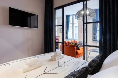 Un ou plusieurs lits dans un hébergement de l'établissement Host Inn Fancy Sūite