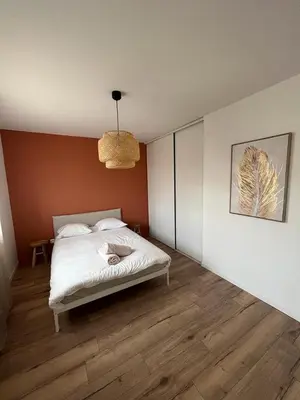 Un ou plusieurs lits dans un hébergement de l'établissement Maison Chaleureuse 2
