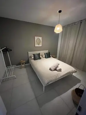 Un ou plusieurs lits dans un hébergement de l'établissement Maison Chaleureuse 2
