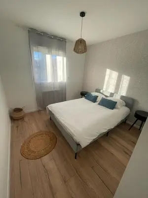 Un ou plusieurs lits dans un hébergement de l'établissement Maison Chaleureuse 2