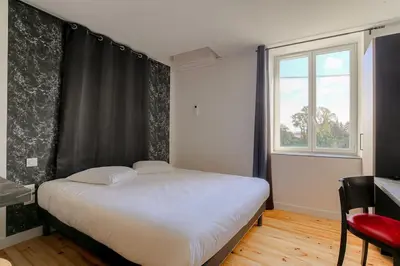 Un ou plusieurs lits dans un hébergement de l'établissement Le Cologne - Les appartements de l'olivier