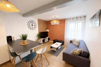 Coin salon dans l'établissement Duplex 2 chambres Meximieux centre ville