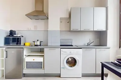 Cuisine ou kitchenette dans l'établissement Le Cocon dans les Nuages