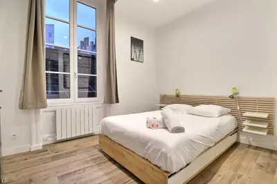 Un ou plusieurs lits dans un hébergement de l'établissement Le Petit Condé - Fully equipped studio - Lyon 2nd