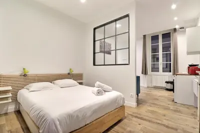 Un ou plusieurs lits dans un hébergement de l'établissement Le Petit Condé - Fully equipped studio - Lyon 2nd