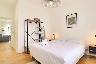 Un ou plusieurs lits dans un hébergement de l'établissement The Tavira - Magnificent renovated T2 apartment - Villeurbanne