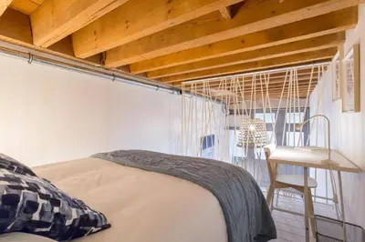 Un ou plusieurs lits dans un hébergement de l'établissement Studio bohème-chic, coeur de Presqu'île, Perrache